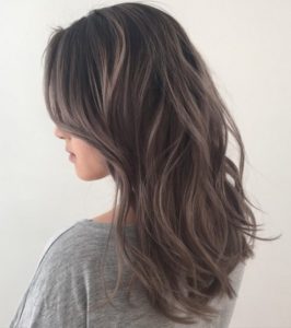 Medium brown hair with silver highlights