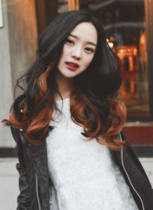 Orange highlights on black hair